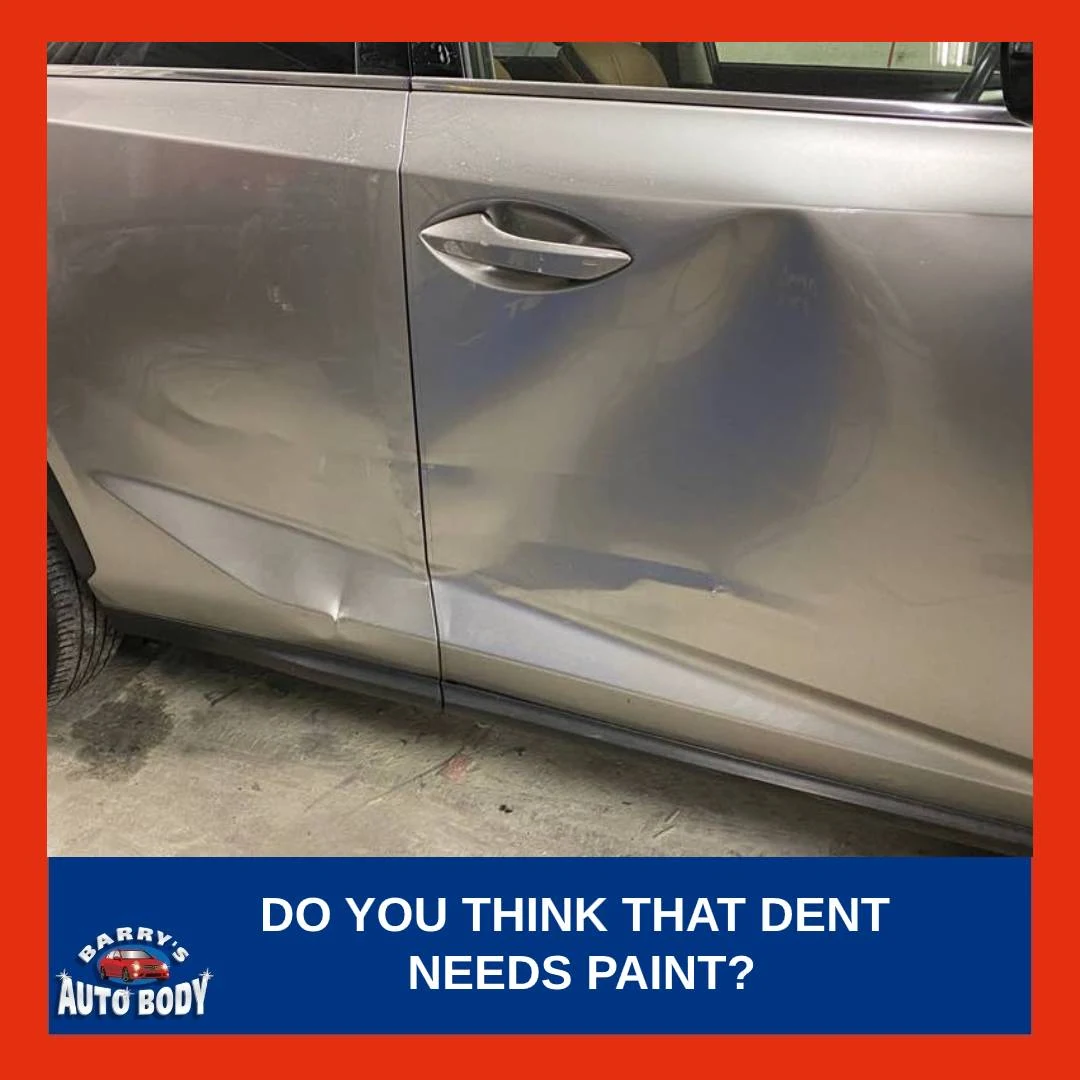 Technician planning to perform Paintless Dent Repair (PDR) on a vehicle's door panel