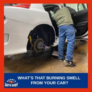 An auto body specialist checking for smell from inside the vehicle after checking the tires.