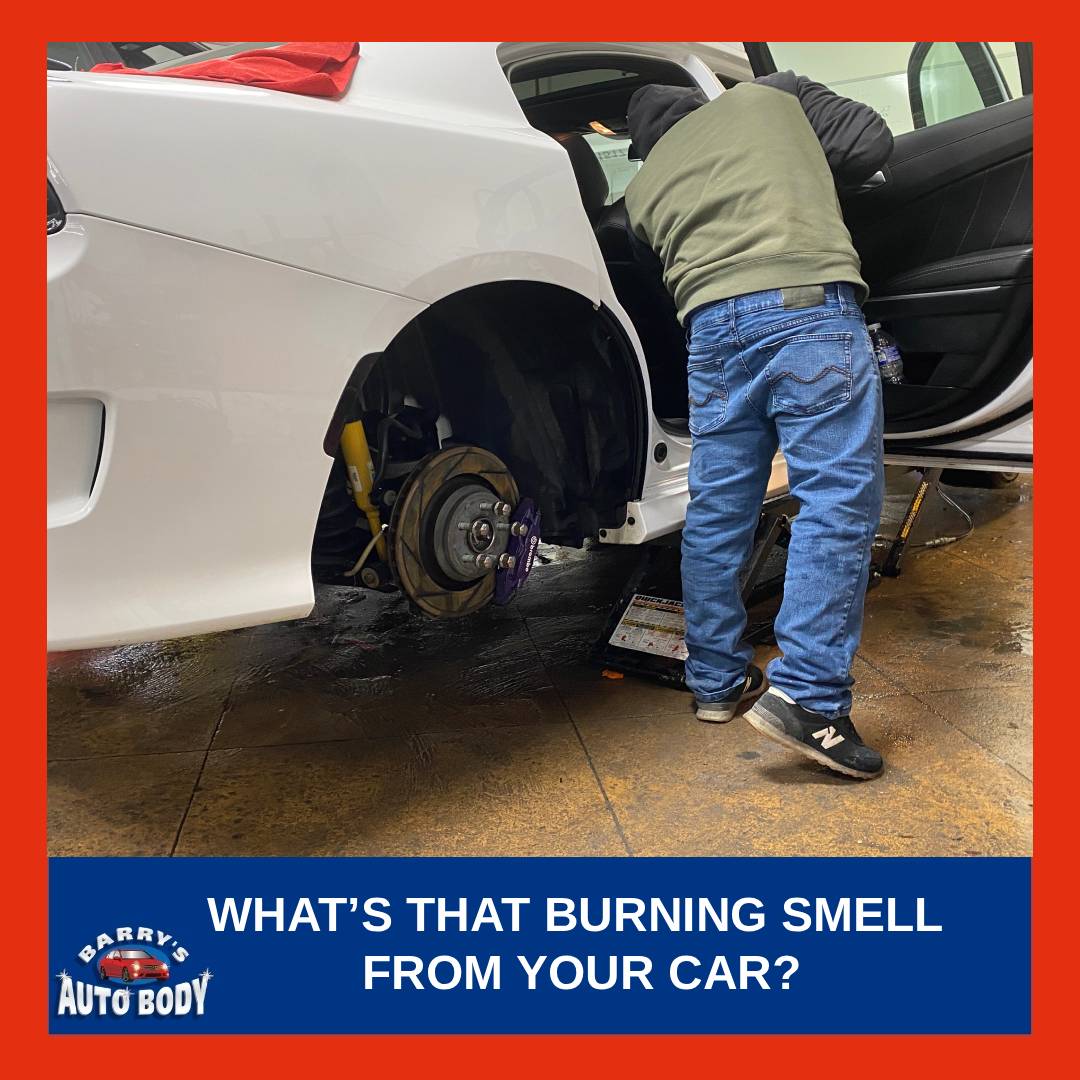 An auto body specialist checking for smell from inside the vehicle after checking the tires.