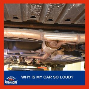 Mechanic inspecting car exhaust system for leaks and rust underneath a vehicle.