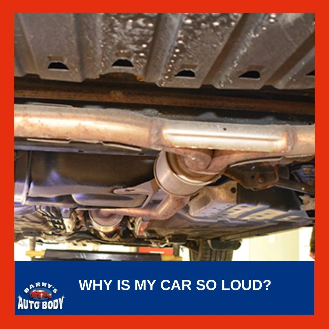 Mechanic inspecting car exhaust system for leaks and rust underneath a vehicle.