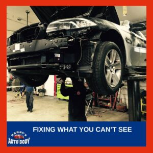 Professional post-accident vehicle inspection using diagnostic tools to identify and repair hidden damage