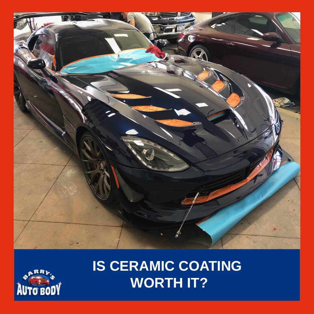 Glossy black vehicle with ceramic coating showing strong water beading and reflective paint finish.