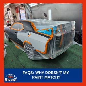 Repaired car panel showing slight paint color difference under sunlight after auto body repair.